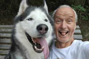 Author Marcel Eschauzier serves strong philosophy author Marcel Eschauzier with his dog having a good time